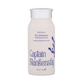 A beige 28g (1oz) Captain Blankenship Refresh Dry Shampoo bottle features blue text and a seaweed graphic, emphasizing Seaweed Powered Hair Care to balance the scalp and boost volume.