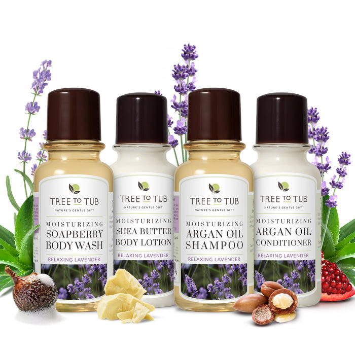 A brown box with a leaf logo sits behind four small Tree To Tub bottles: the Relaxing Lavender Travel Essentials Set, a vegan, sulfate-free kit with Argan Oil Conditioner, Soapberry Hair & Body Wash, and Shea Butter for Body.
