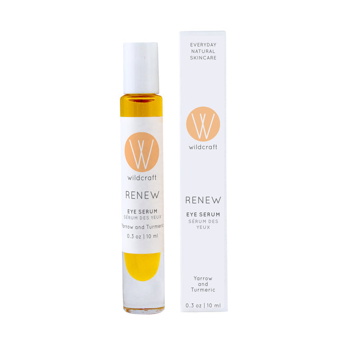 A 0.3 oz (10 ml) bottle of Wildcrafts Renew Eye Serum, featuring yarrow and turmeric to combat puffiness and dark circles, sits beside its packaging, showcasing the brands logo and natural skincare expertise.