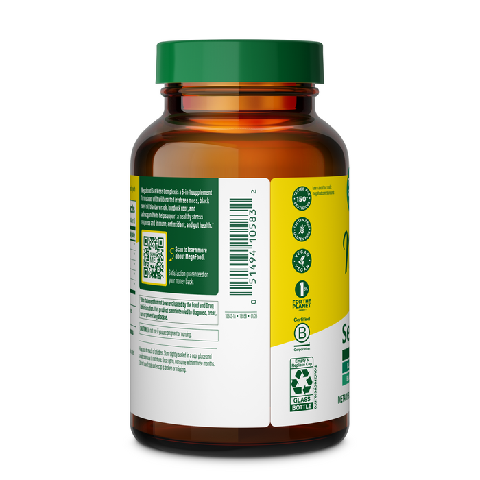 A brown glass MegaFood Sea Moss Complex bottle with a green cap, showing the side label in green, white, and yellow with product info, certifications, a QR code, and a barcode.