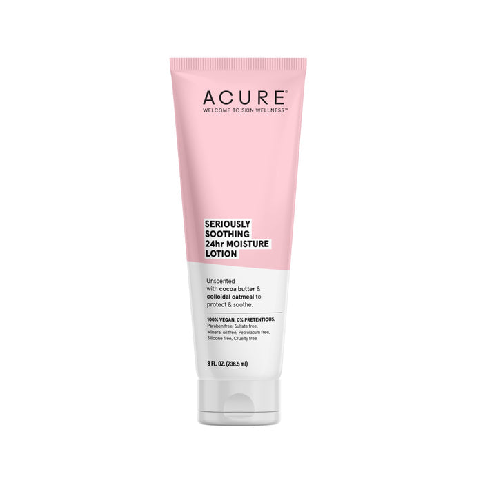 A pink and white tube of Seriously Soothing 24hr Moisture Lotion by Acure, ideal for sensitive skin, features an unscented formula with cocoa butter and colloidal oatmeal. Offers 8 fl oz (236.5 ml) of gentle care.
