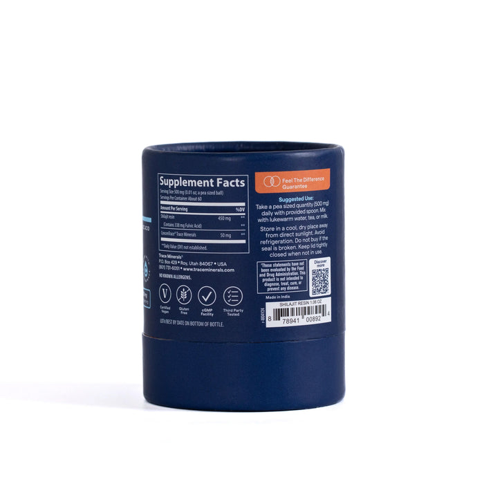 A dark blue cylindrical container of Trace Minerals Shilajit Resin, featuring a visible label with supplement facts, suggested use instructions, and a barcode, all displayed on a white background.