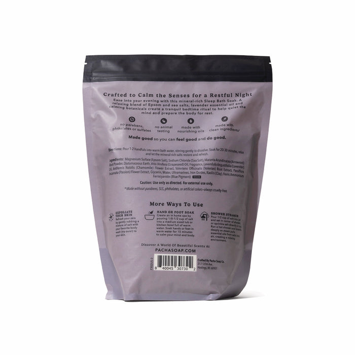 The back of a lavender Sleep Epsom Salt Bath Soak bag by Pacha Soap Co. displays calming bath soak benefits with Epsom salt and lavender, usage instructions, and brand info. The upright bag is set against a white background.