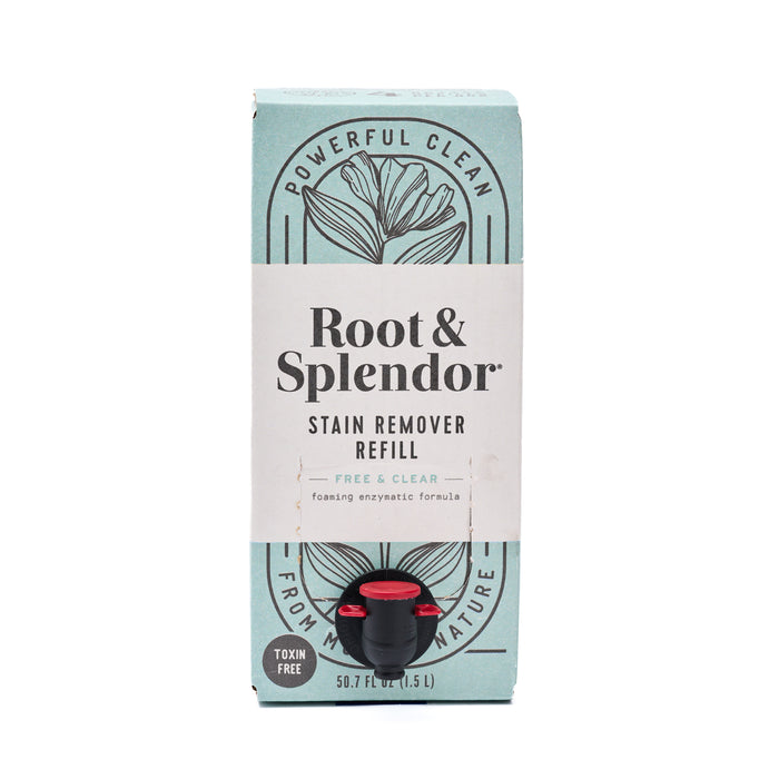 A box of Root and Splendor Stain Remover Refill in a light blue package with black floral design, featuring a red-capped dispenser and labeled “Powerful Clean,” “Free & Clear,” and “Toxin Free.”.