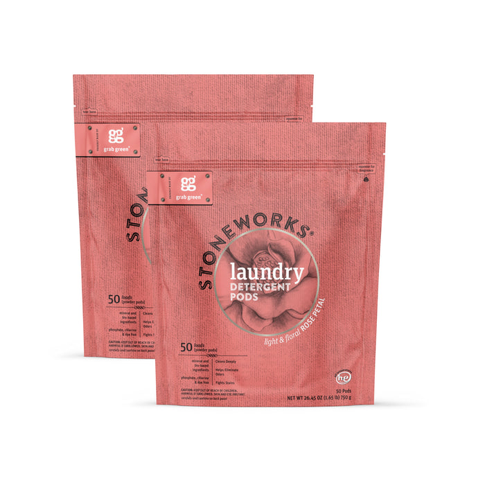 Two pink grab green Stoneworks Laundry Detergent Pods - Rose Petal pouches stand upright. Each resealable pouch holds 50 deep cleaning pods with a light, floral rose petal scent and features branding on the front.