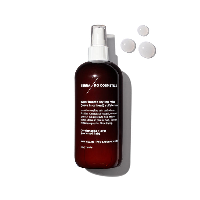 A brown bottle of Terra Beauty Bars Super Boost+ Styling Mist with a white spray nozzle stands proudly, its label highlighting salon-quality hair care. Three droplets rest beside it on a white background, casting a shadow to the right.