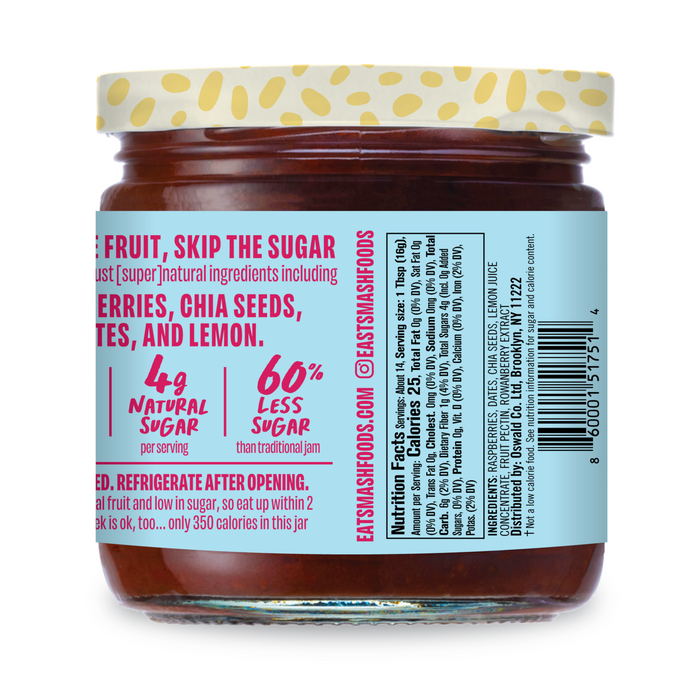 A glass jar of Smash Foods Superfood Jam - Raspberry with a yellow lid features a light blue label: Just fruit, skip the sugar, highlighting 4g natural sugar and 60% less sugar than traditional jam. Ingredients and nutrition facts are visible.