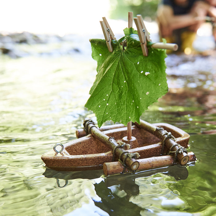 The HABA Terra Kids Cork Boat DIY Activity Kit lets kids 5+ build an eco-friendly toy boat from corks, sticks, and a leaf sail secured with clothespins. Award-winning fun for young explorers near the waters edge.