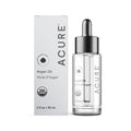A bottle of Acure The Essentials Argan Oil (1 fl oz / 30 mL) with a dropper top is shown beside its white box. The packaging highlights it as a Skin Superfood and displays the USDA Organic certification.