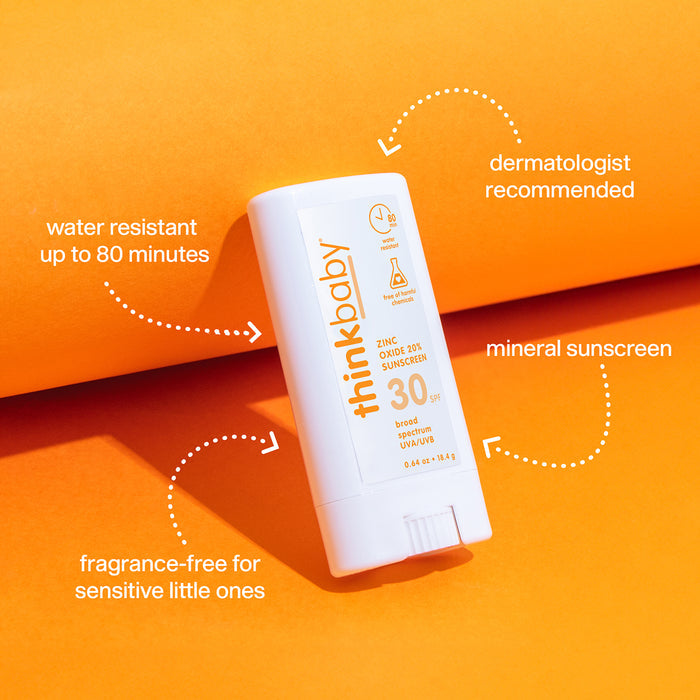 A white thinksun thinkbaby SPF 30 Face & Body Sunscreen Stick is shown on an orange background. Text notes its broad-spectrum UVA/UVB protection, 80-minute water resistance, dermatologist recommendation, mineral formula, and fragrance-free.