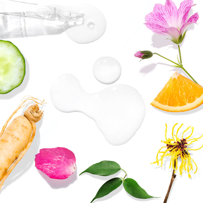 Flat lay of Tree To Tubs Witch Hazel Toner for Sensitive Skin featuring cucumber slice, ginseng root, rose petal, eucalyptus leaves, toner droplets with hyaluronic acid, purple flower, orange slice on a white background with green tea.