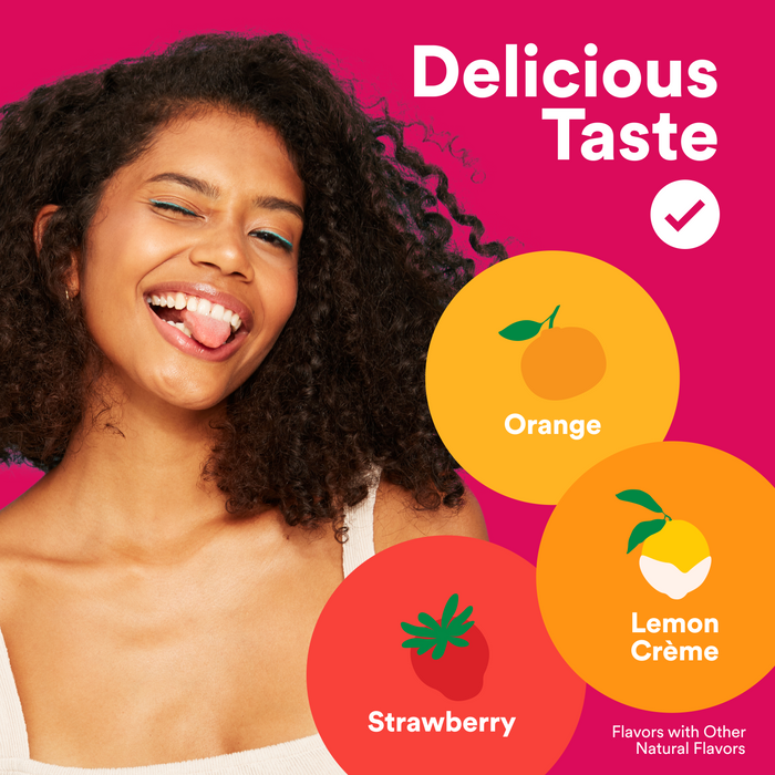 A smiling woman with curly hair sticks out her tongue beside colorful circles labeled Orange, Lemon Crème, and Strawberry on a pink background with “Delicious Taste”—perfect for Smarty Pants Womens Plus Multi & Omegas 90count.